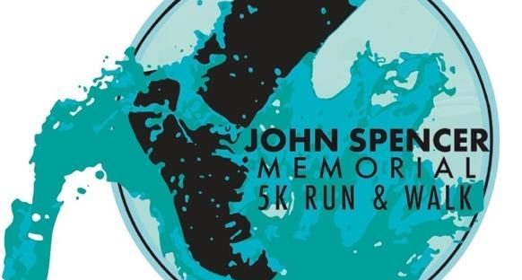 A sneakered foot graphic appears alongside the text, "John Spencer Memorial 5k Run and Walk."