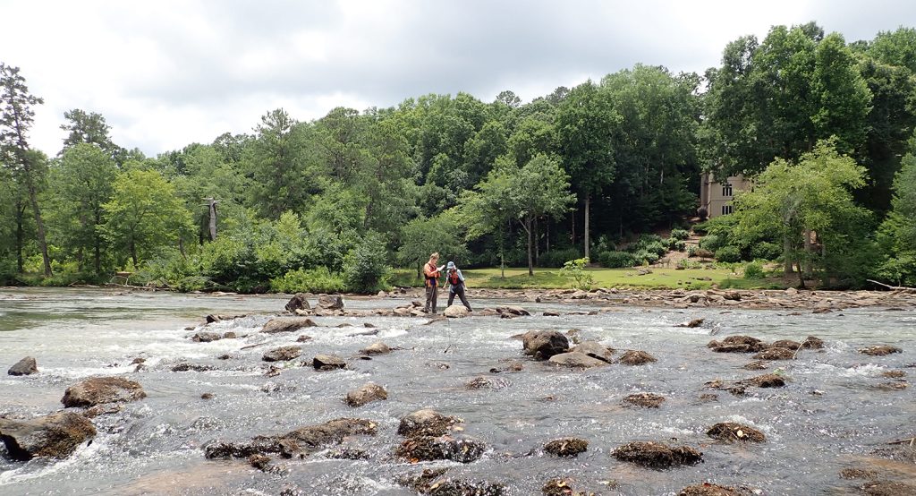Researchers work in the Oconee River