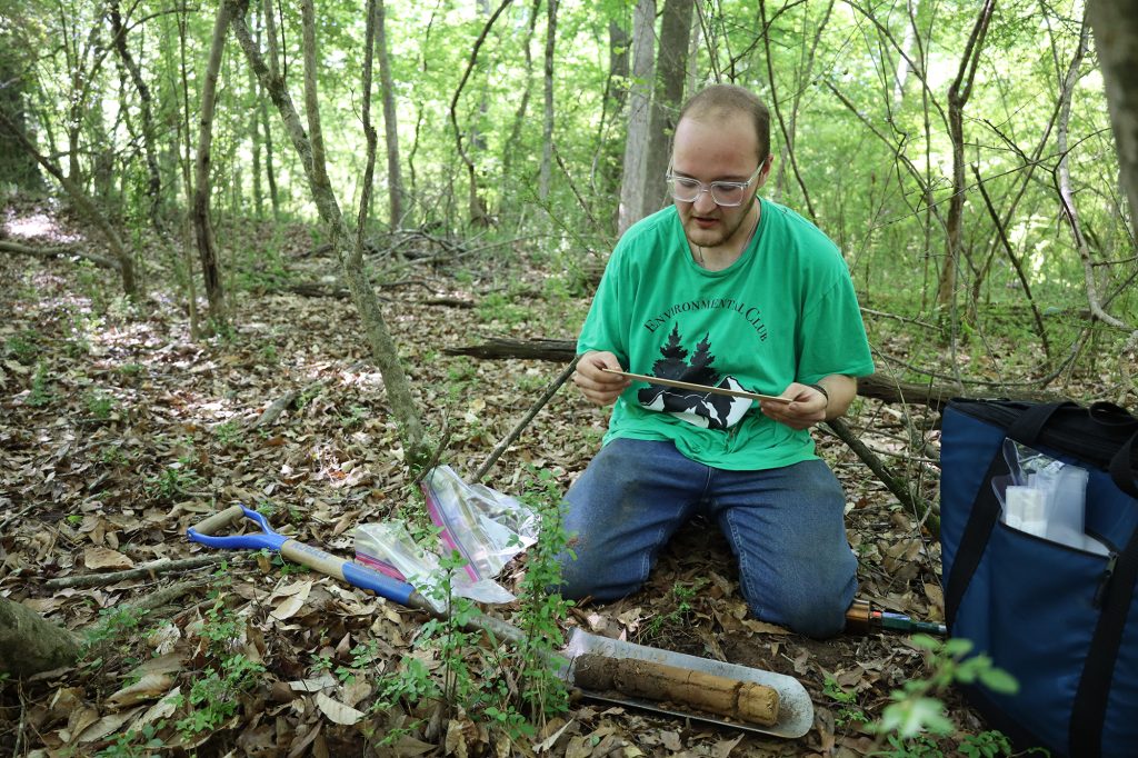 Student researcher measures soil gradients